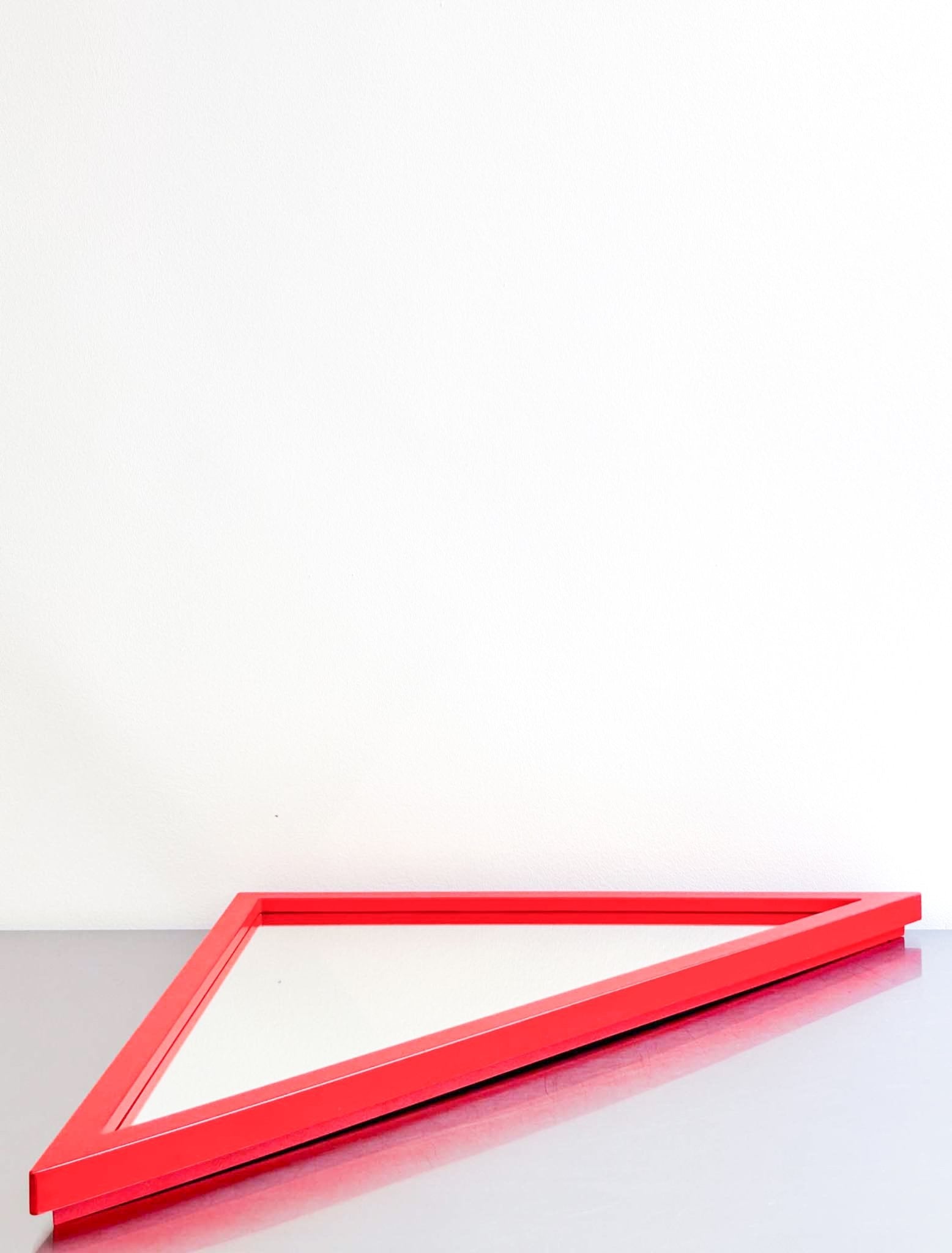 red triangle mirror by Anna Castelli by artetica - Design from Milan