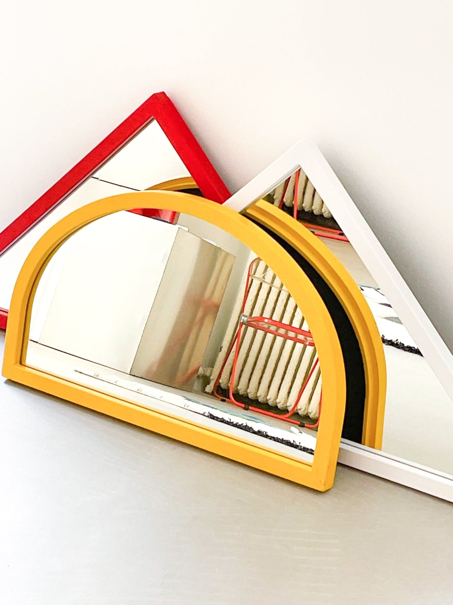 red triangle mirror by Anna Castelli by artetica - Design from Milan