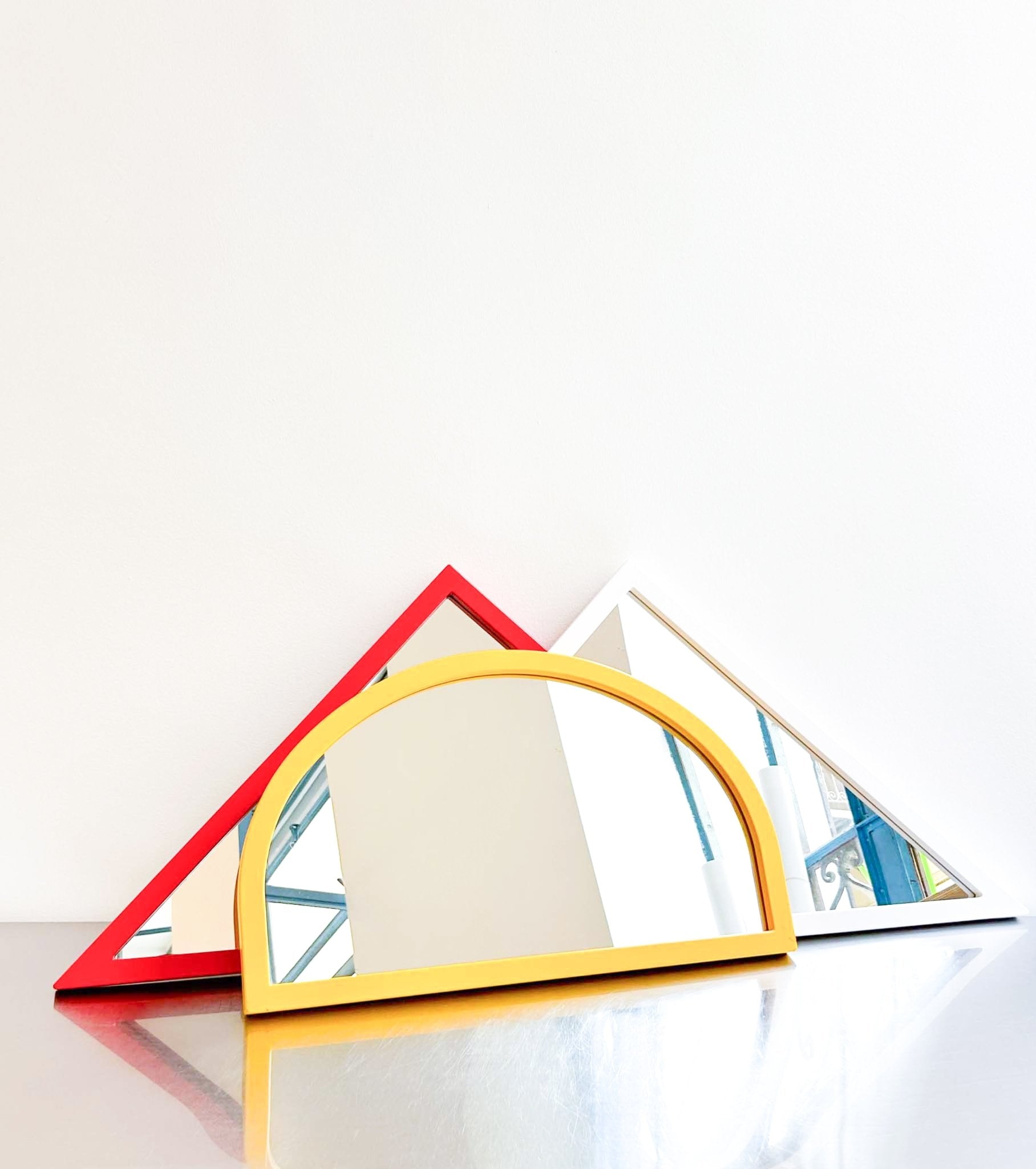red triangle mirror by Anna Castelli by artetica - Design from Milan