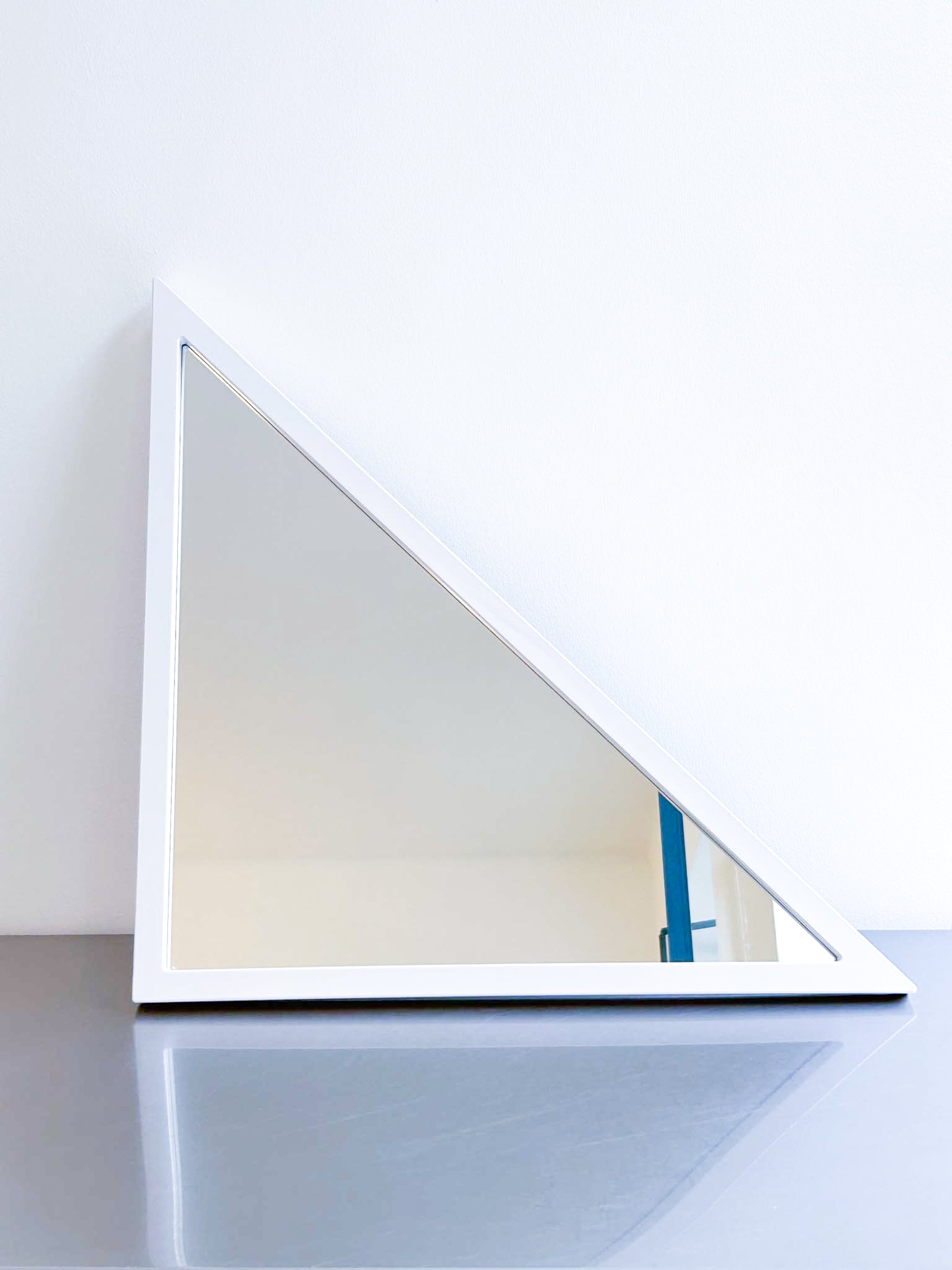 white triangle mirror by Anna Castelli