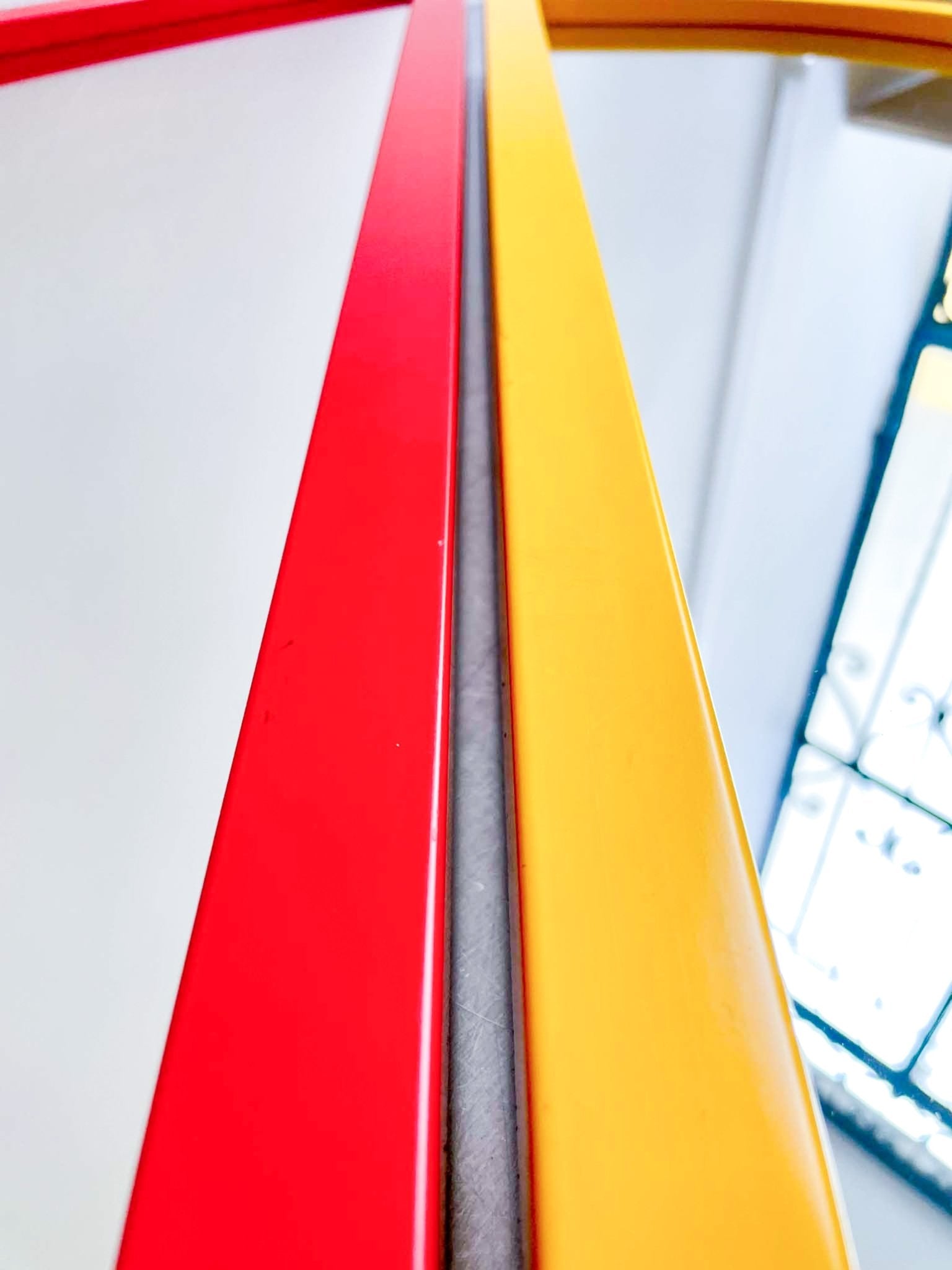 red triangle mirror by Anna Castelli by artetica - Design from Milan