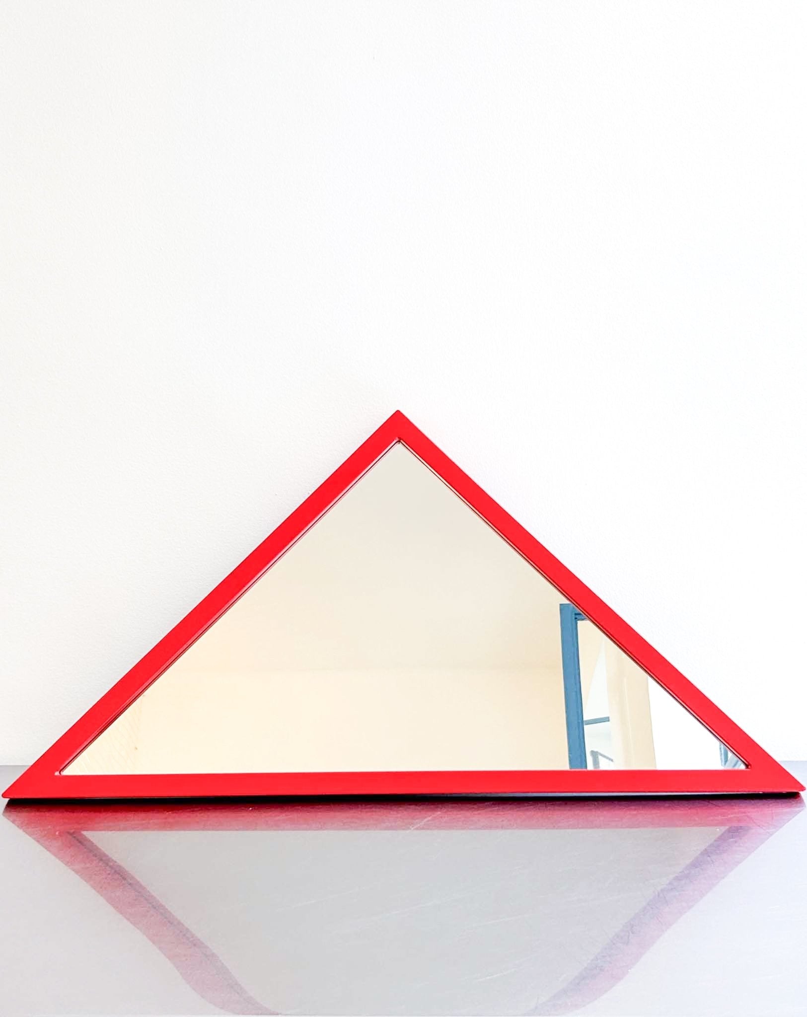 red triangle mirror by Anna Castelli by artetica - Design from Milan