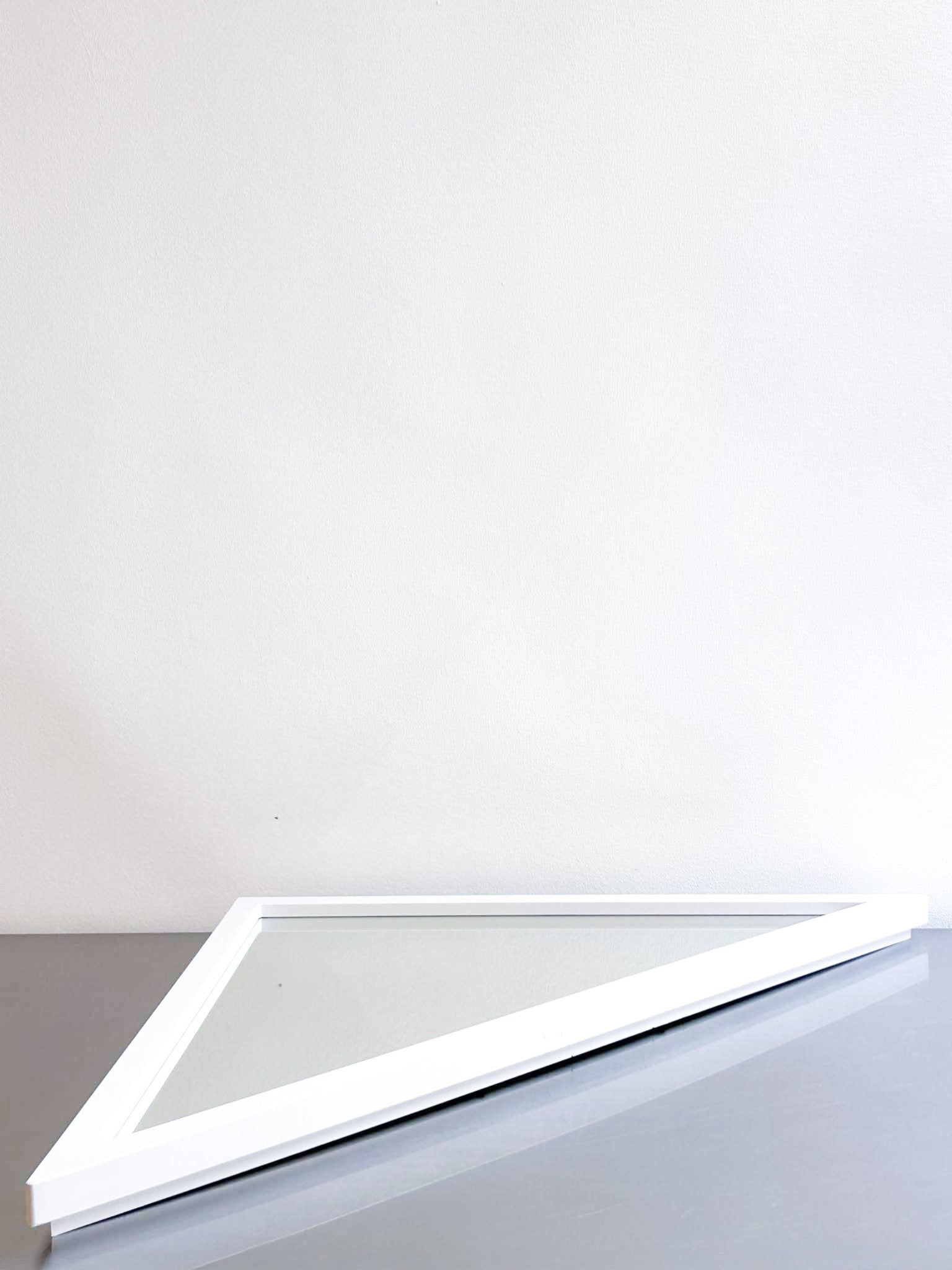 white triangle mirror by Anna Castelli by artetica - Design from Milan